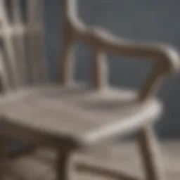 Close-up view of a gray wood rocking chair showcasing its unique grain patterns