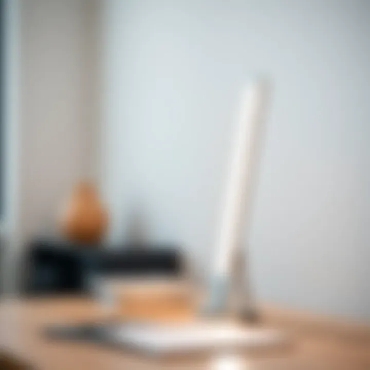 Close-up of a sleek fluorescent table lamp on a minimalist desk